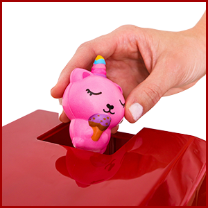 loading the mini claw machine with prizes