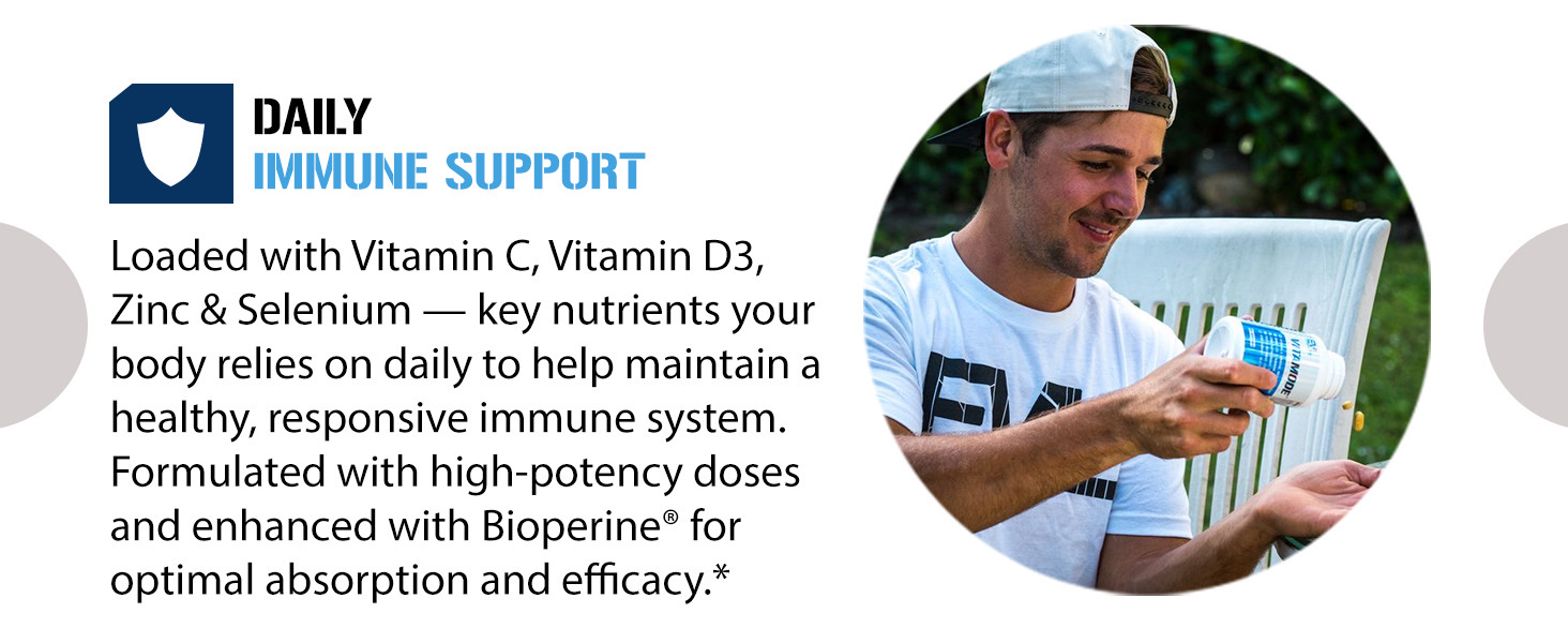 Male holding Vitamode bottle outdoors. Daily immune support with Vitamin C, D3, zinc, selenium.*