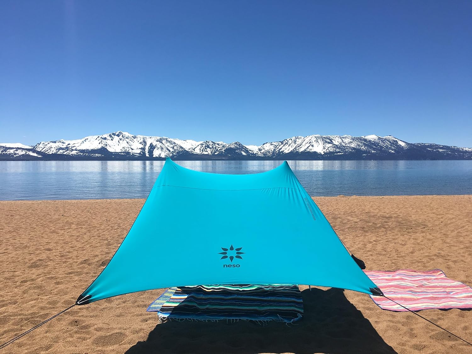 Neso Portable Beach Tent Sun Shelter with Sand Anchor - Lightweight Beach Shade Canopy - Easy Setup for Family Outings - Patented Reinforced Corners - UPF 50+ Sun Protection - 7 x 7ft - White