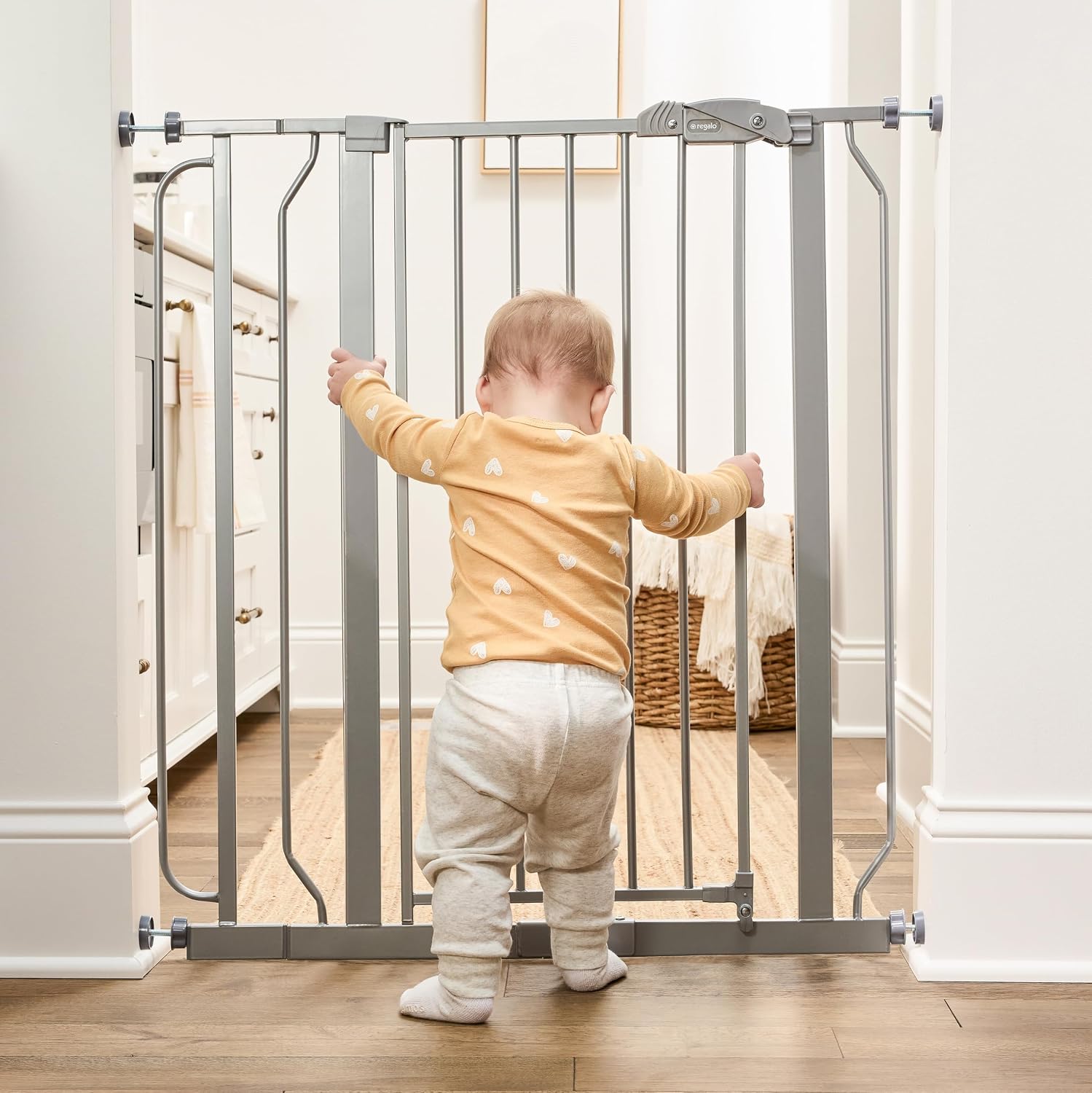 Regalo Safety 29"-49" Extra Wide Baby Gate, Bottom of Stairs & Doorways | Pressure Mounted with Door, For Babies, Toddlers & Pets, White, Tested & Trusted for 30 Years