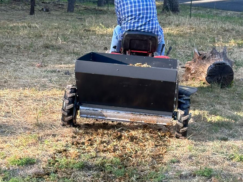 Titan attachments with ATV spreader broadcasters and drop spreaders.