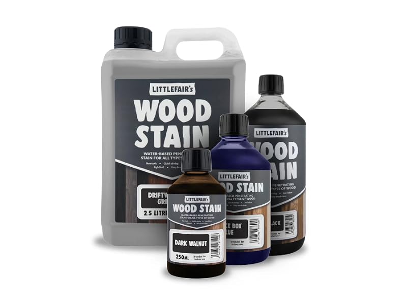 Text reads 'WOOD STAIN' on multiple containers of wood finishing products in various sizes, including bottles and jugs.