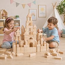 2 Toddlers playing with the wood blocks and making a castle of them