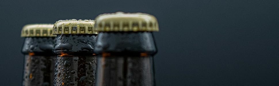 Close up of beer bottle neck with gold cap