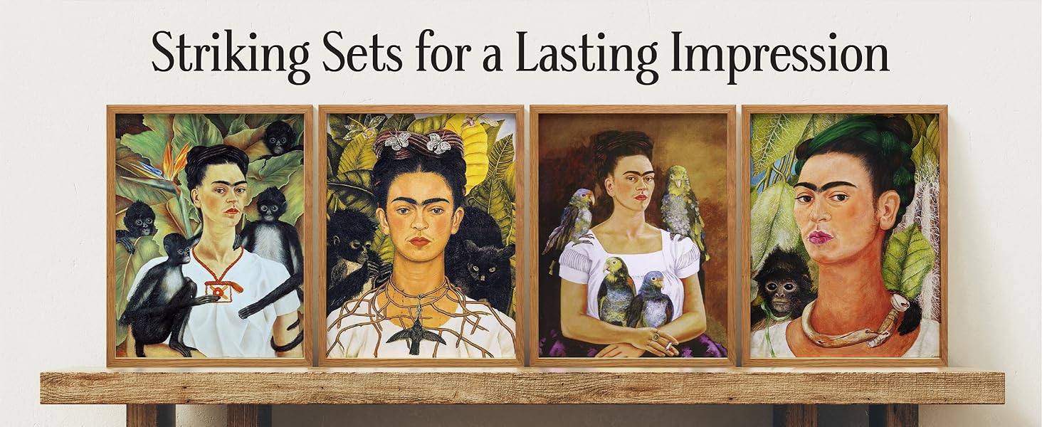 Four bold Frida Kahlo art prints in matching wood frames on rustic wood shelf