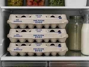 egg cartons stacked in a fridge
