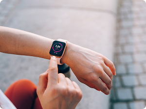woman looking at smart watch