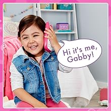 Kid pretends to talk on A-Meow-Zing Phone. Phone says: Hi it’s me, Gabby!