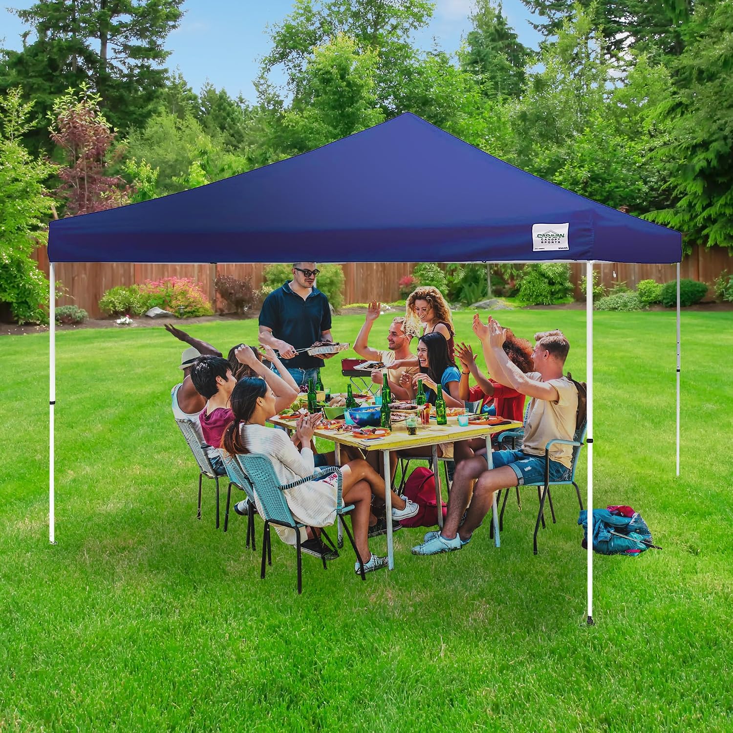 Caravan Canopy 12 by 12 Foot Polyester Straight Steel Leg Instant Pop Up Canopy Tent with Adjustable Height for Outdoor Events, Blue | 150D polyester top with 99 percent UV protection, 3 height settings to 9 ft, steel frame, roller bag and 4 stakes