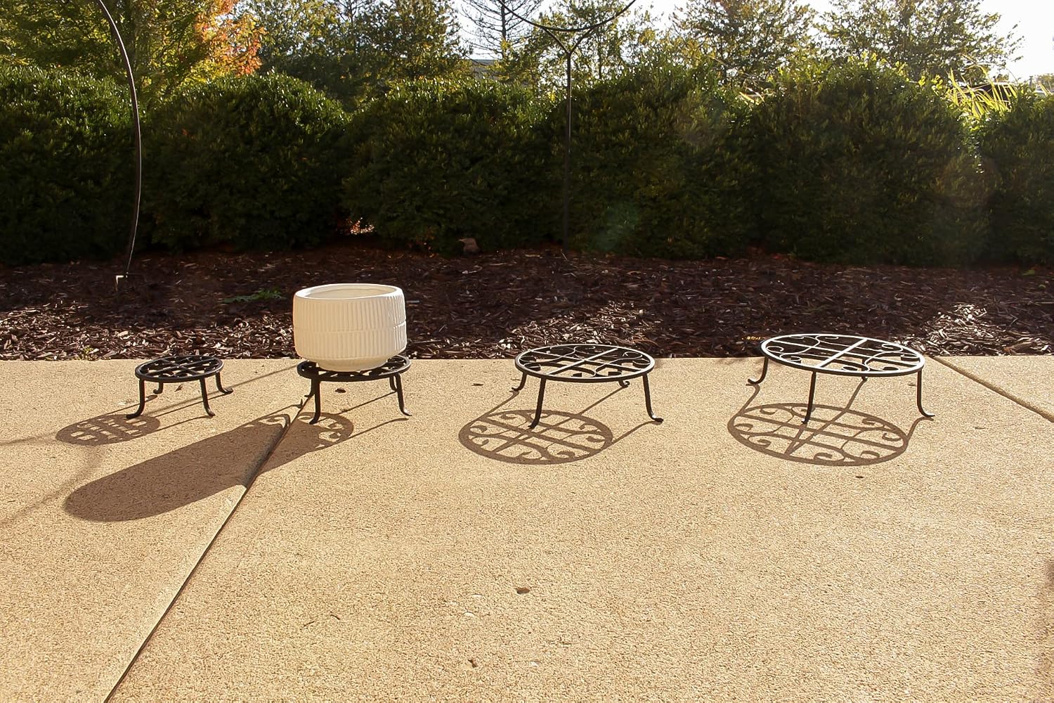 Red Carpet Studios Set of Four Round Black Iron Plant Stands, Scroll Pattern