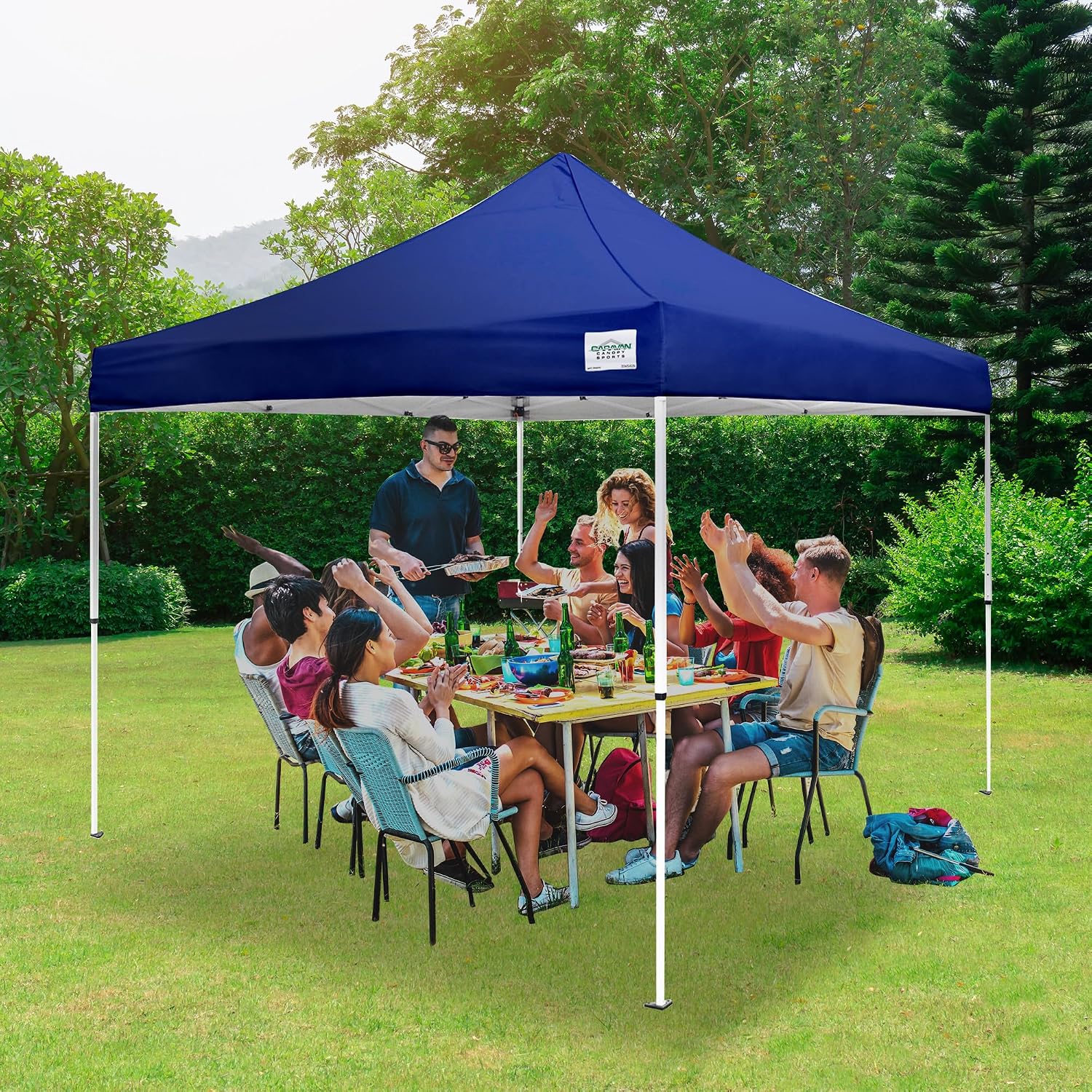 Caravan Canopy 12 by 12 Foot Polyester Straight Steel Leg Instant Pop Up Canopy Tent with Adjustable Height for Outdoor Events, Blue | 150D polyester top with 99 percent UV protection, 3 height settings to 9 ft, steel frame, roller bag and 4 stakes