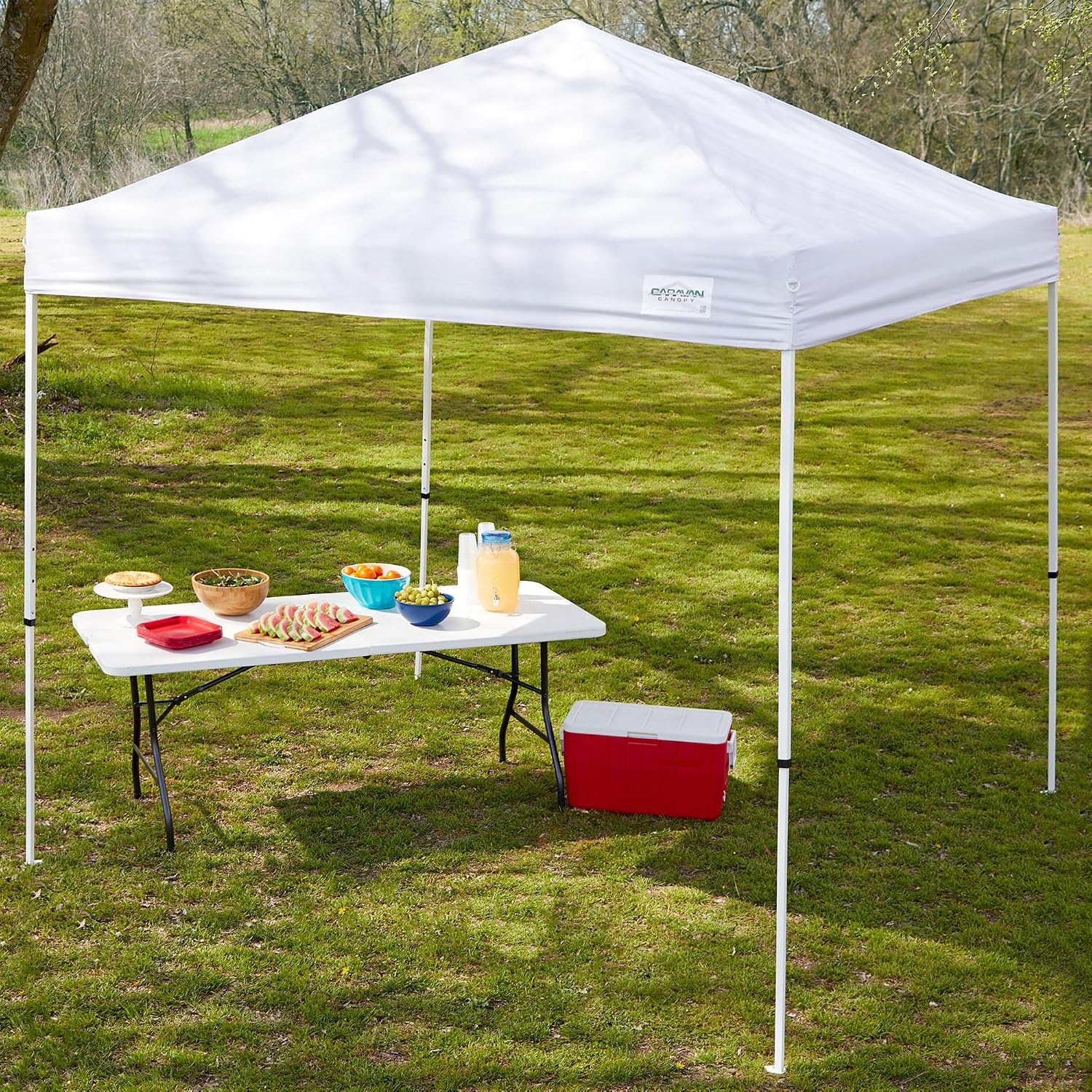 Caravan Canopy 12 by 12 Foot Polyester Straight Steel Leg Instant Pop Up Canopy Tent with Adjustable Height for Outdoor Events, Blue | 150D polyester top with 99 percent UV protection, 3 height settings to 9 ft, steel frame, roller bag and 4 stakes