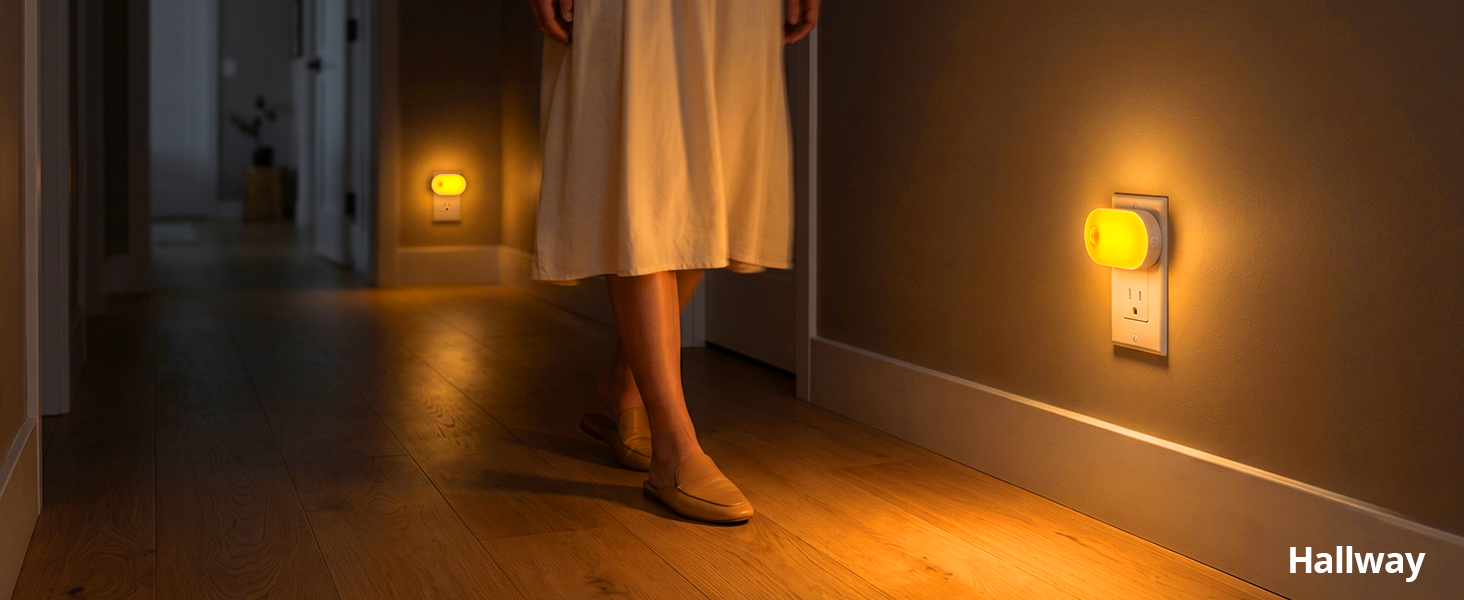 Motion sensor plug-in night light illuminating a hallway.