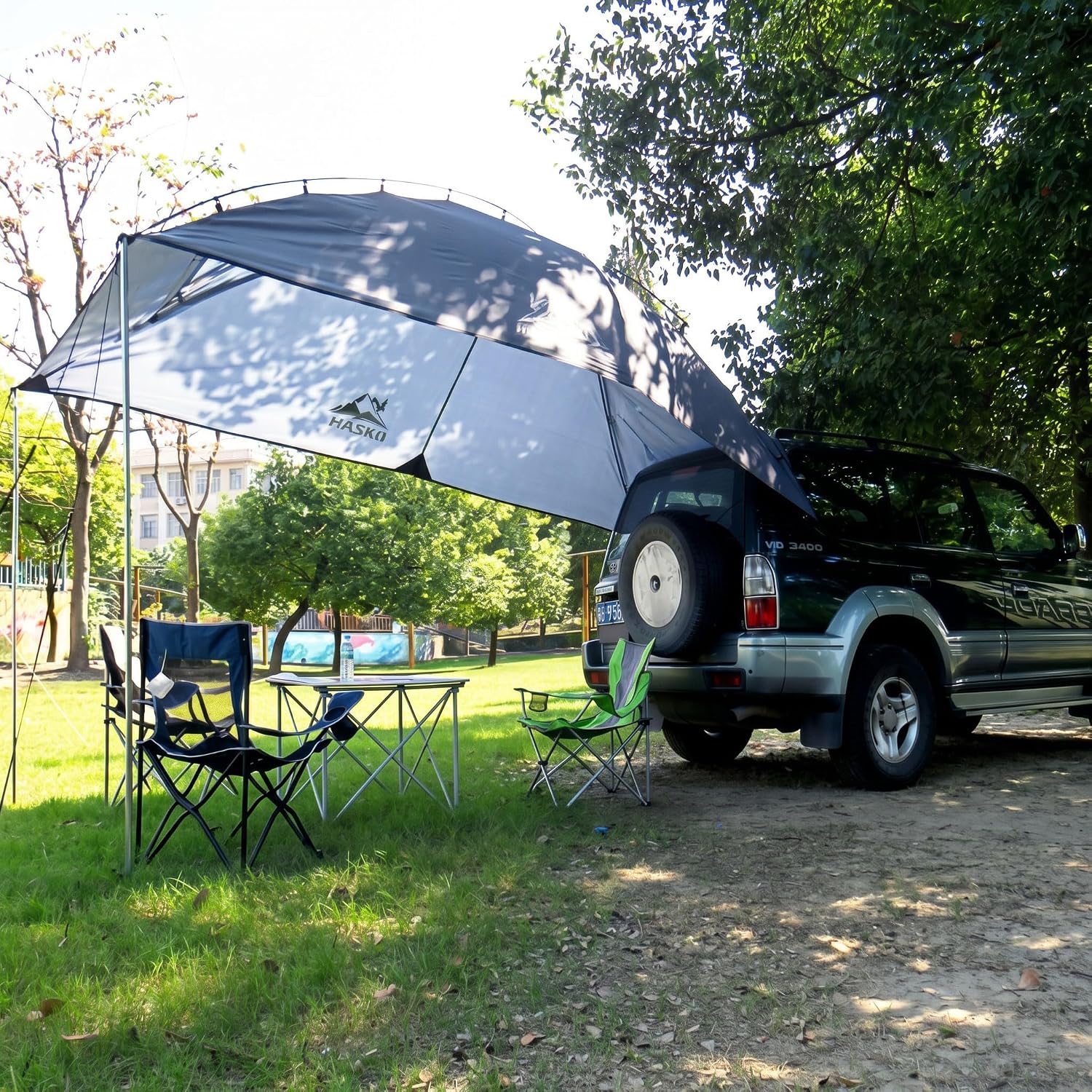 Hasika Waterproof SUV Tailgate Tent and Car Awning | Universal fit for SUVs Vans RV Trailer. Features heavy-duty suction cups, adjustable poles
