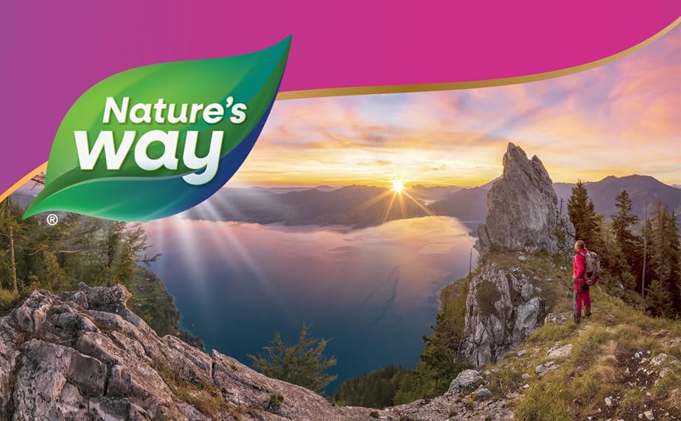 Beauty banner featuring a woman looking out over a lake during a hike