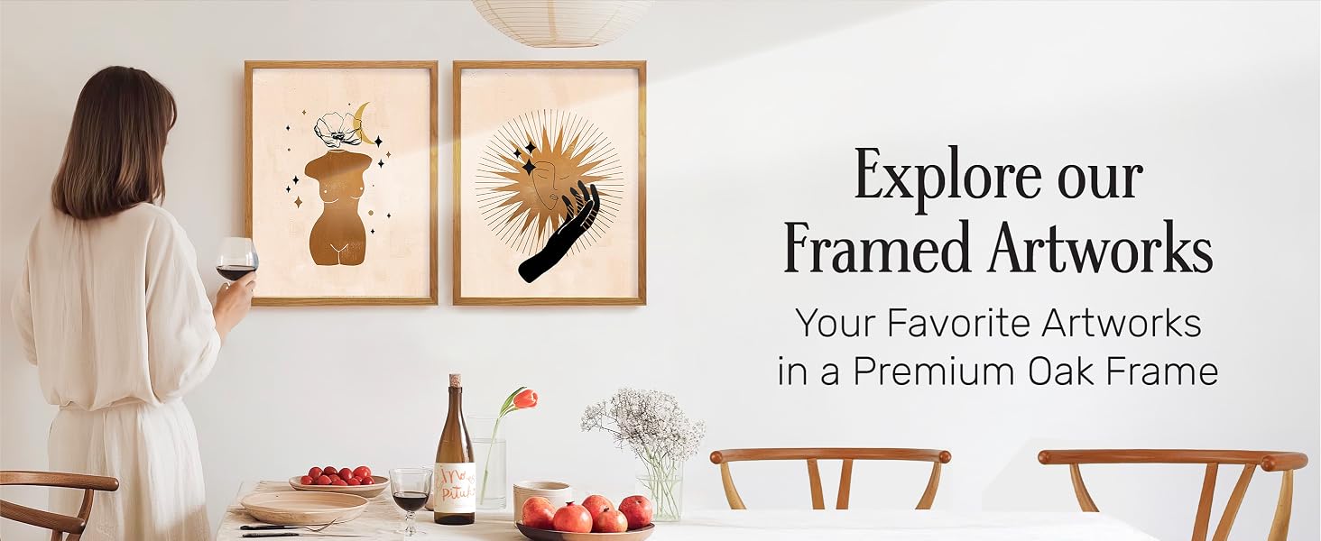 Dining room with oak-framed modern art prints and a woman viewing them