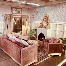 a living room with a couch, a fireplace and a mirror.