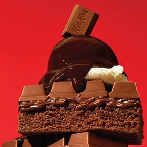Kit Kat Brownies topped with wafer candy, ice cream and chocolate fudge sauce