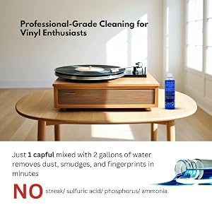 A vinyl record spinning on a turntable with iSonic CSVR01 cleaning solution bottle
