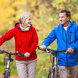 A couple riding bicycles outdoors