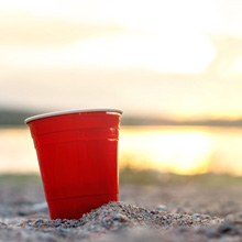 Reusable plastic party cups are great for outdoor use. Snap-on lids, double-wall insulated.