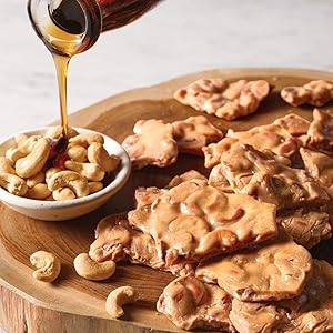 cashew brittle on a wooden board