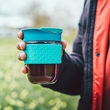 a man holding a cup of tea