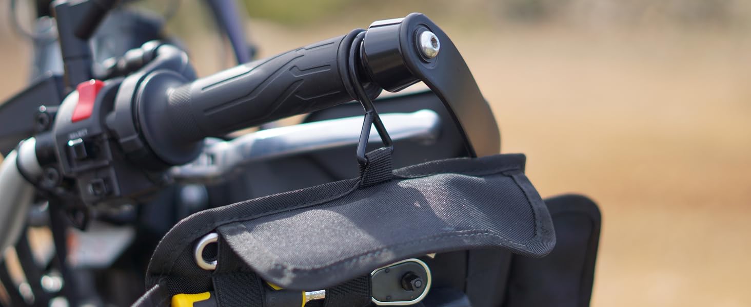 Motorbike tool kit organizer hanging from handlebar