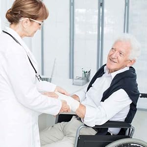 A nurse attending an elderly patient in a wheelchair