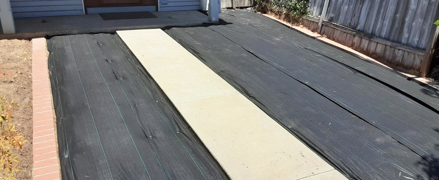 Landscape fabric installed at the backyard
