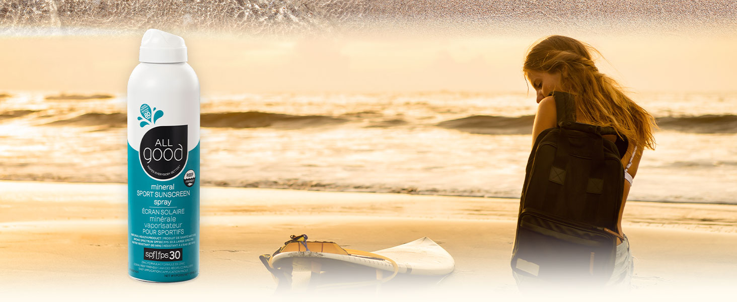 Woman at the beach with All Good Sport Spray
