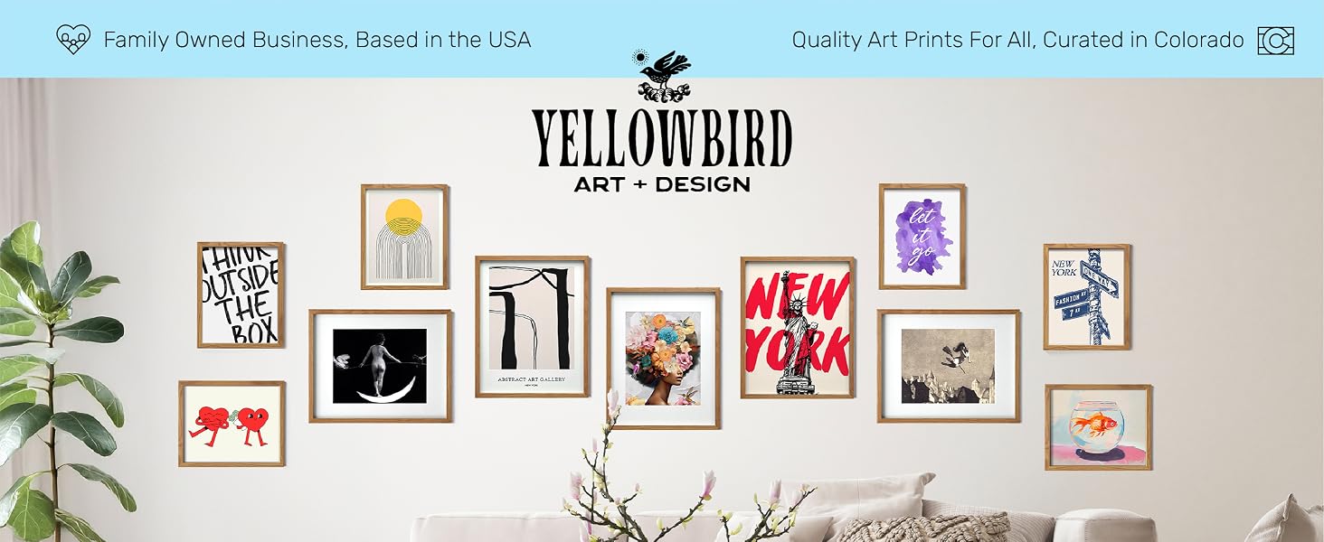 Framed art gallery wall with ten prints in various styles above a neutral couch