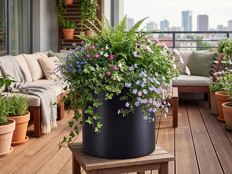 Lightweight 14 inch black outdoor fiberstone planter for wood deck patio and heavy trailing plants.