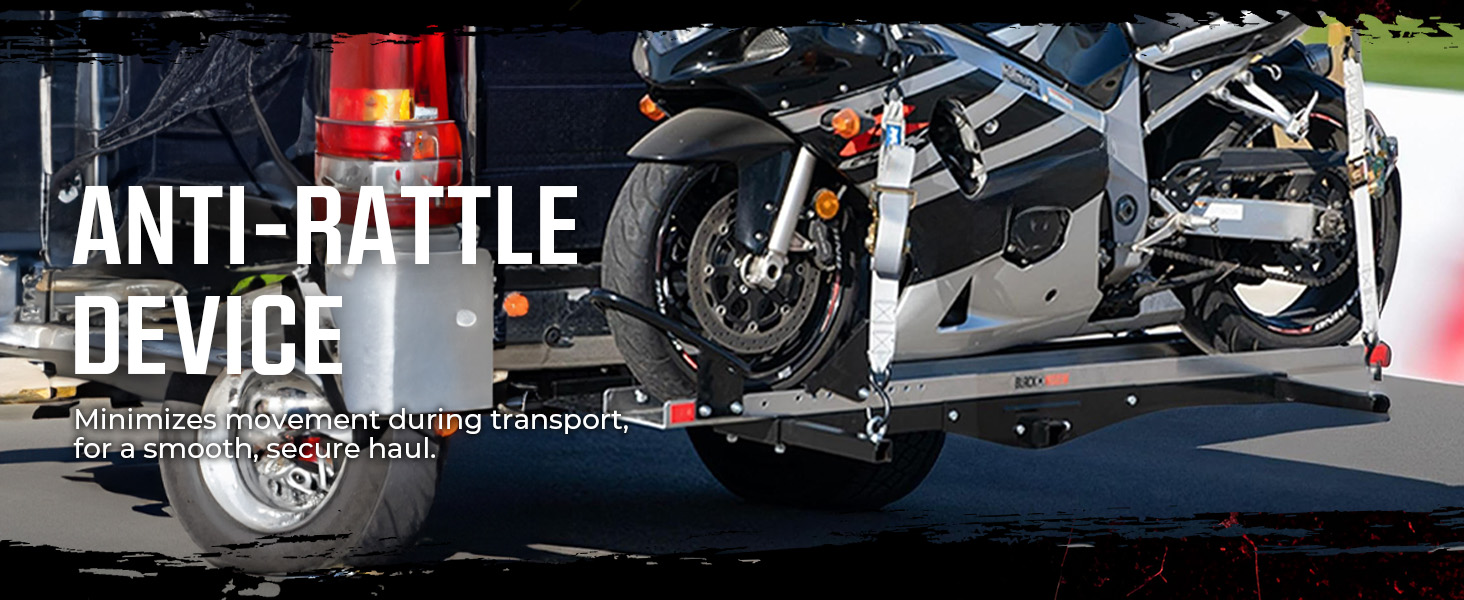 Close-up of motorcycle tire on aluminum dolly showing ride-on, ride-off design and locking caster.
