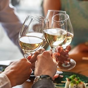 Toasting white wine at wedding