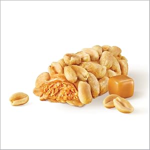 A Payday peanut caramel candy bar broken open to show its caramel filling