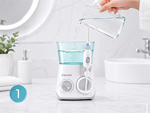 White kitchen appliance with blue circular indicator on left side, appears to be a blender or food processor with white housing and control panel.