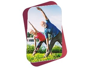 Healthy older couple doing yoga