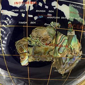 a fine made globe always with some Mother of Pearl Shells, Sorry for PVC balls , your AU looks pinky