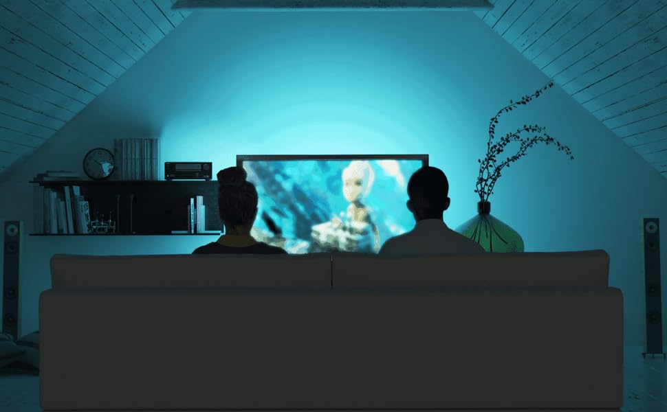 People watching tv in blue lit room