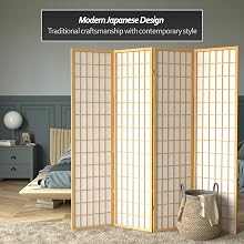 A natural wood finish shoji screen room divider provides privacy in a bedroom
