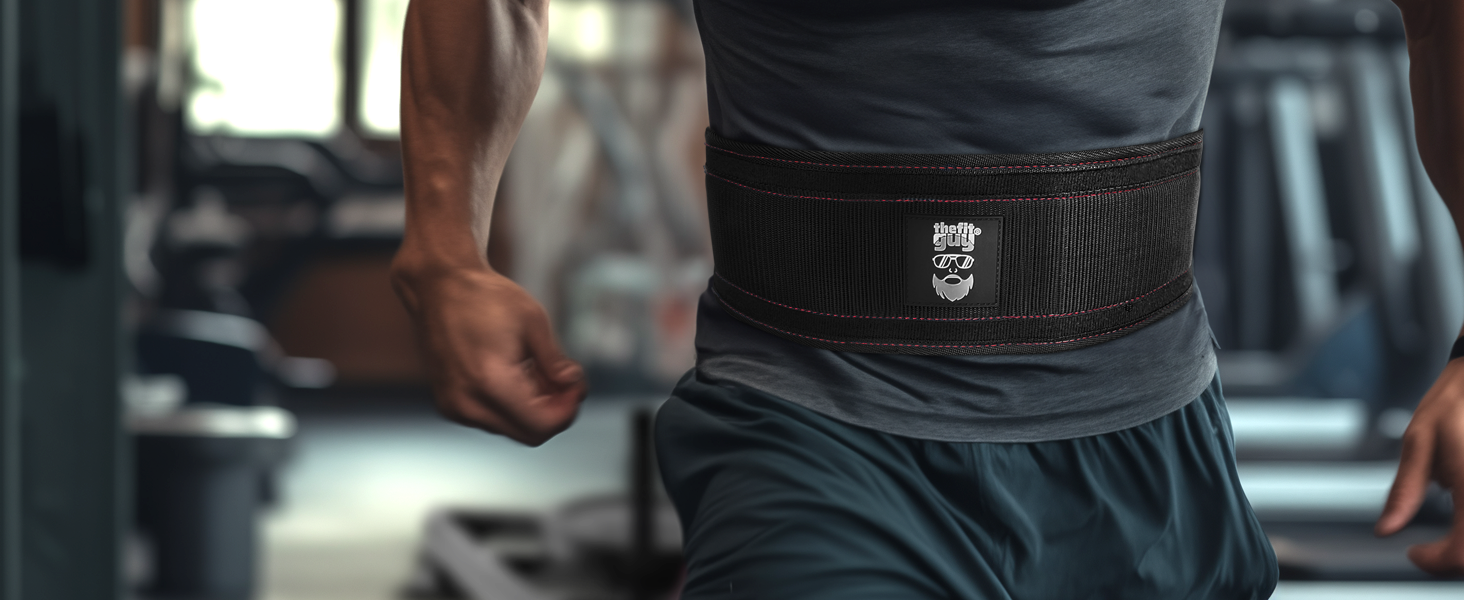 Athlete wearing padded sled pulling belt during resistance training for strength and agility drills