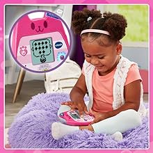 Kid sits on fluffy pillow playing games on the A-Meow-Zing Phone. Inset shows the Mix a Potion Game.