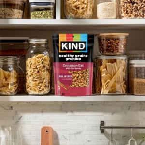 Box of KIND Breakfast Protein being pulled from reusable grocery bag
