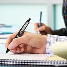 Photo shows. Dr. Grip Full Black pen in use