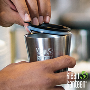putting on a tumbler lid on an 8 oz tumbler with coffee