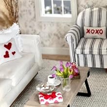 a living room with a couch, coffee table, and a chair.