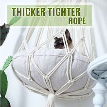 Cat resting in a handmade boho cat hammock woven with thicker, tighter durable cotton rope.