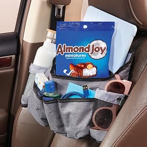 A bag of Almond Joy candy bars in a car storage organizer