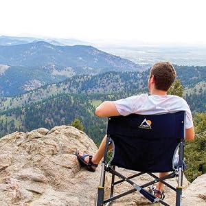 Man enjoying the view sitting on a GCI Outdoor chair